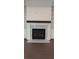 Fireplace with a marble hearth and mantel and a stylish shiplap accent wall adds visual interest at 4525 Aiden Way, Cumming, GA 30041