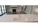 Modern kitchen with white countertops and backsplash, featuring a kitchen island at 4525 Aiden Way, Cumming, GA 30041
