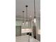 Modern kitchen island with quartz countertops and pendant lighting at 4525 Aiden Way, Cumming, GA 30041