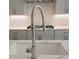 A kitchen with modern design and a stainless steel faucet at 4525 Aiden Way, Cumming, GA 30041