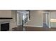 Beautiful living room with fireplace, staircase, and open layout leading to the kitchen and dining at 4525 Aiden Way, Cumming, GA 30041