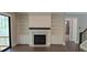 Bright living room with a fireplace, custom built-ins, and seamless access to an outdoor deck at 4525 Aiden Way, Cumming, GA 30041