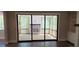 Screened patio features a cozy brick fireplace and a seamless flow from indoor to outdoor living at 4525 Aiden Way, Cumming, GA 30041