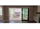 View of outdoor patio with brick fireplace, screened in windows, and wood ceiling at 4525 Aiden Way, Cumming, GA 30041
