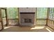 The porch features a wood floor, brick fireplace, and screened in area, perfect for enjoying the outdoor scenery at 4525 Aiden Way, Cumming, GA 30041