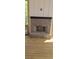 This screened-in porch has a brick fireplace, wood floors and wood railings and offers a peaceful outdoor setting at 4525 Aiden Way, Cumming, GA 30041