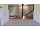 Staircase featuring carpeted steps and a dark wood and iron railing at 4525 Aiden Way, Cumming, GA 30041