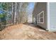 Home's backyard with a wooden fence and patio at 7110 Ravenwood Ln, Lithonia, GA 30038