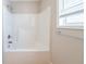 Clean bathroom with a tub shower combo at 7110 Ravenwood Ln, Lithonia, GA 30038