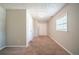 Bright bedroom featuring carpet and ample closet space at 7110 Ravenwood Ln, Lithonia, GA 30038