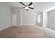 Bright bedroom featuring neutral walls and carpet at 7110 Ravenwood Ln, Lithonia, GA 30038