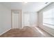 Spacious bedroom with neutral walls and carpet at 7110 Ravenwood Ln, Lithonia, GA 30038