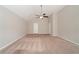 Large bedroom with neutral walls and carpet flooring at 7110 Ravenwood Ln, Lithonia, GA 30038