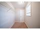 Spacious walk-in closet with wire shelving and neutral carpeting at 7110 Ravenwood Ln, Lithonia, GA 30038