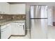 Kitchen boasts granite countertops and white cabinets at 7110 Ravenwood Ln, Lithonia, GA 30038