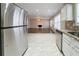 Kitchen with stainless steel appliances and view of living room at 7110 Ravenwood Ln, Lithonia, GA 30038