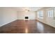 Living room with hardwood floors and fireplace at 7110 Ravenwood Ln, Lithonia, GA 30038