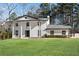 Front exterior view of a two story home with columns and landscaping at 2283 Stratmor Dr, Tucker, GA 30087