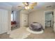 Serene bedroom with a large bean bag chair and plenty of closet space at 239 Darwish Dr, Mcdonough, GA 30252