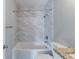 Clean bathroom, featuring a bathtub, granite vanity, and marble tile at 1255 Glen Forest Way, Decatur, GA 30032