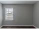 Simple bedroom featuring wood-look floors and a window with blinds at 1255 Glen Forest Way, Decatur, GA 30032