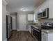 Modern kitchen with stainless steel appliances and granite countertops at 1255 Glen Forest Way, Decatur, GA 30032