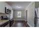 Eat-in kitchen with stainless steel appliances and granite countertops at 1255 Glen Forest Way, Decatur, GA 30032