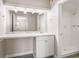 Bright bathroom with white vanity, marble countertop and shower at 175 Rue Fontaine, Lithonia, GA 30038