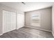 Spacious bedroom with double closets and grey vinyl flooring at 175 Rue Fontaine, Lithonia, GA 30038