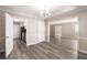 Dining room with gray flooring and views into kitchen and living room at 175 Rue Fontaine, Lithonia, GA 30038