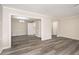 Open dining area with wood-look flooring and a chandelier at 175 Rue Fontaine, Lithonia, GA 30038