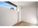 Small, private patio with vertical blinds and exterior access at 175 Rue Fontaine, Lithonia, GA 30038