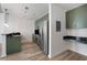 Modern kitchen with green cabinets and stainless steel appliances at 400 W Peachtree Nw St # 2313, Atlanta, GA 30308