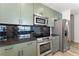 Modern kitchen with stainless steel appliances and granite countertop at 400 W Peachtree Nw St # 2313, Atlanta, GA 30308