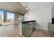 Open concept kitchen with island and city views at 400 W Peachtree Nw St # 2313, Atlanta, GA 30308