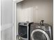 Bright laundry room with washer and dryer at 400 W Peachtree Nw St # 2313, Atlanta, GA 30308