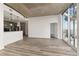 Open living area with hardwood floors and kitchen access at 400 W Peachtree Nw St # 2313, Atlanta, GA 30308