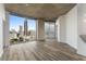Modern living room with hardwood floors and stunning city views at 400 W Peachtree Nw St # 2313, Atlanta, GA 30308