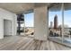 Bright living room with hardwood floors and city views at 400 W Peachtree Nw St # 2313, Atlanta, GA 30308