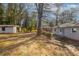 Large backyard with detached garage and mature trees at 667 Steve Sw Dr, Atlanta, GA 30315