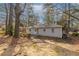 Ranch house with a large backyard and mature trees at 667 Steve Sw Dr, Atlanta, GA 30315