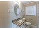 Clean bathroom, granite countertop and tiled walls at 667 Steve Sw Dr, Atlanta, GA 30315