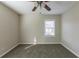 Bright bedroom with ceiling fan and neutral carpeting at 667 Steve Sw Dr, Atlanta, GA 30315