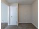 Small bedroom with closet and neutral carpeting at 667 Steve Sw Dr, Atlanta, GA 30315
