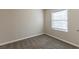 Simple bedroom with window and neutral wall color at 667 Steve Sw Dr, Atlanta, GA 30315