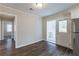 Bright dining room with wood-look floors and access to the backyard at 667 Steve Sw Dr, Atlanta, GA 30315