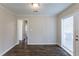 Bright dining room with wood-look floors and access to the backyard at 667 Steve Sw Dr, Atlanta, GA 30315