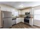 Renovated kitchen with stainless steel appliances and granite countertops at 667 Steve Sw Dr, Atlanta, GA 30315