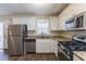 Renovated kitchen with stainless steel appliances and granite countertops at 667 Steve Sw Dr, Atlanta, GA 30315