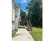 Two-story house with a wooden deck and stairs, and well-maintained yard at 1886 Clay Sw Dr, Marietta, GA 30064